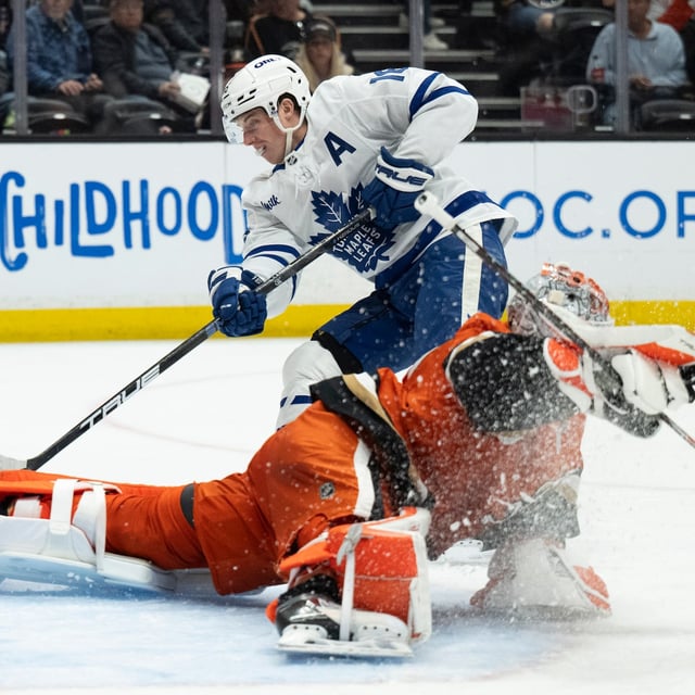 Toronto Maple Leafs right wing Mitch Marner (16) scores past Anaheim Ducks goaltender Lukas Dostal (1) during the second period of an NHL hockey game, Sunday, March 30, 2025, in Anaheim, Calif. (AP Photo/Kyusung Gong)