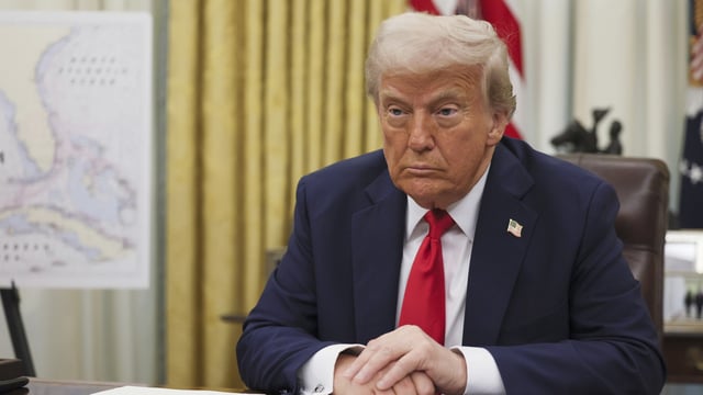 President Donald Trump listens to a question from a reporter before signing an executive order in the Oval Office of the White House in Washington, Monday, March 31, 2025.