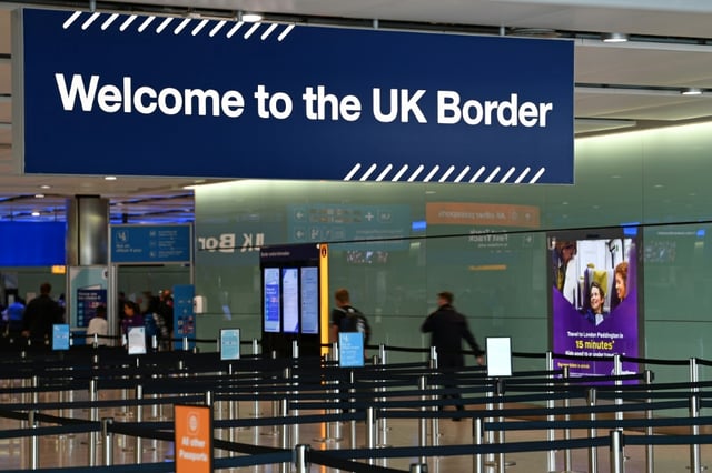 A large sign welcomes travellers arriving at passport control in Terminal 2 at London's Heathrow Airport