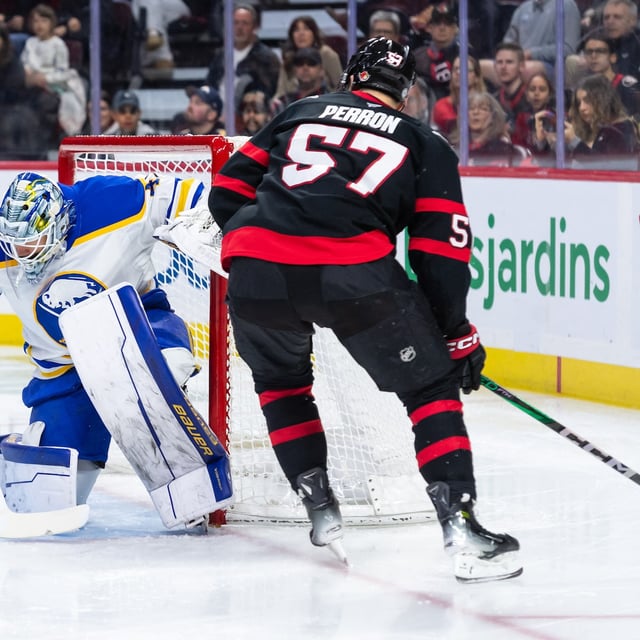 Apr 1, 2025; Ottawa, Ontario, CAN; Buffalo Sabres goalie James Reimer (47) makes a save on a shot from Ottawa Senators left wing David Perron (57) in the first period at the Canadian Tire Centre. Mandatory Credit: Marc DesRosiers-Imagn Images