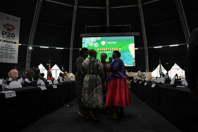 Members of parliament stand in a makeshift dome after South Africa's Finance Minister Enoch Godongwana's 2025 budget speech was postponed, in Cape Town, South Africa, February 19, 2025. REUTERS/Esa Alexander/File Photo
