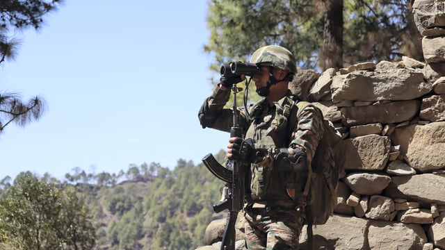An army jawan keeps vigil at LoC in Poonch.