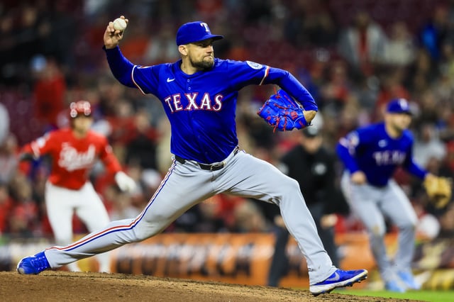 Apr 1, 2025; Cincinnati, Ohio, USA; Texas Rangers starting pitcher Nathan Eovaldi (17) pitches against the Cincinnati Reds in the ninth inning at Great American Ball Park. Mandatory Credit: Katie Stratman-Imagn Images