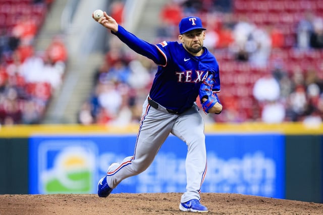 Apr 1, 2025; Cincinnati, Ohio, USA; Texas Rangers starting pitcher Nathan Eovaldi (17) pitches against the Cincinnati Reds in the third inning at Great American Ball Park. Mandatory Credit: Katie Stratman-Imagn Images