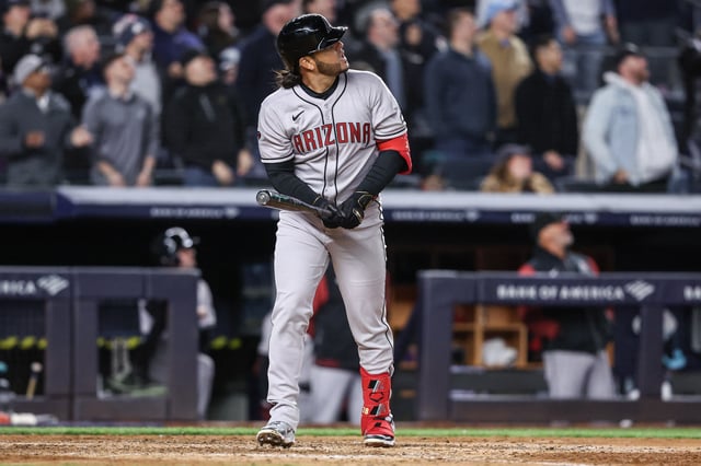 Apr 1, 2025; Bronx, New York, USA;  Arizona Diamondbacks third baseman Eugenio Suárez (28) hits a grand slam home run in the eighth inning against the New York Yankees at Yankee Stadium. Mandatory Credit: Wendell Cruz-Imagn Images