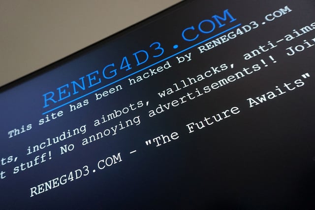 The words "This site has been hacked by RENEG4DE.COM" are displayed on the archived site of a rival video game cheating website in this April 1, 2025 screenshot. REUTERS/Raphael Satter