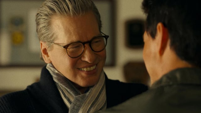 Val Kilmer smiling at Tom Cruise in Top Gun Maverick.