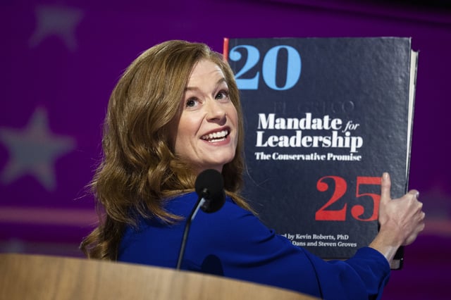 Michigan State Sen. Mallory McMorrow holds a book of the Heritage Foundation&#39;s Project 2025 during the Democratic National Convention at the United Center in Chicago, Ill., on Monday, August 19, 2024.