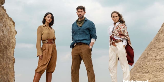 Eiza Gonzales, John Krasinski, and Natalie Portman pose outside in adventurers' outifts for an official image for the movie 'Fountain of Youth' by Guy Ritchie 