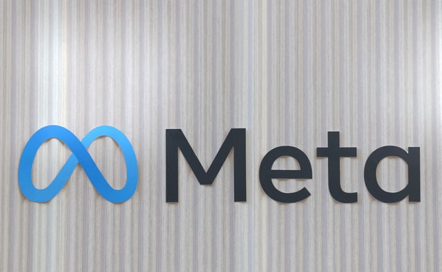 The logo of Meta is seen at the entrance of the company's temporary stand ahead of the World Economic Forum (WEF) in Davos, Switzerland January 18, 2025. REUTERS/Yves Herman/File Photo