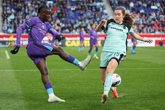 Mar 23, 2025; Harrison, New Jersey, USA; Orlando Pride forward Prisca Chilufya (9) kicks the ball as Gotham FC defender Tierna Davidson (15) defends during the first half at Sports Illustrated Stadium. Mandatory Credit: Vincent Carchietta-Imagn Images/File Photo