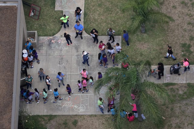 Migrant children make their way inside a building at Casa Presidente, an immigrant shelter for unaccompanied minors, in Brownsville, Texas, U.S., June 23, 2018.