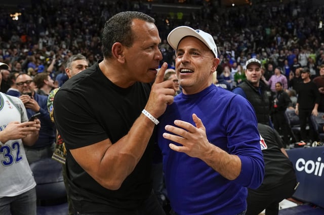 Apr 12, 2022; Minneapolis, Minnesota, USA;  Minnesota Timberwolves co-minority owners Alex Rodriguez and Marc Lore celebrate a victory over the Los Angeles Clippers after a play-in game at Target Center. Mandatory Credit: Nick Wosika-USA TODAY Sports/File photo