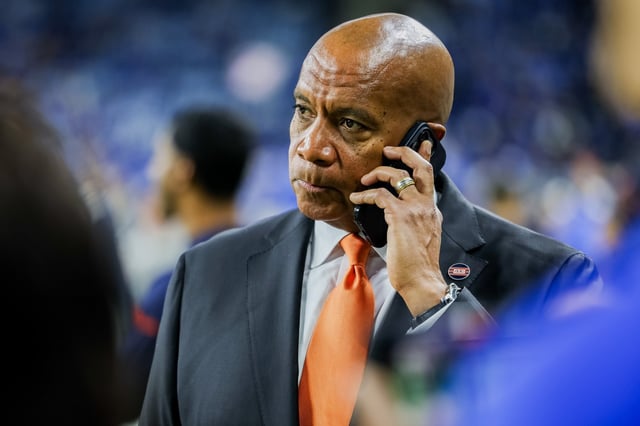 Bears President Kevin Warren talks on the sideline before a game against the Lions at Ford Field in Detroit on Nov. 28, 2024. (Tess Crowley/Chicago Tribune)
