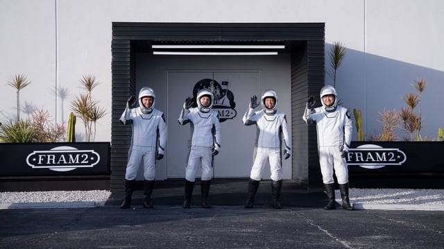 The four international astronauts of a crewed mission known as Fram2 pose for a photo during a dress rehearsal of the launch.