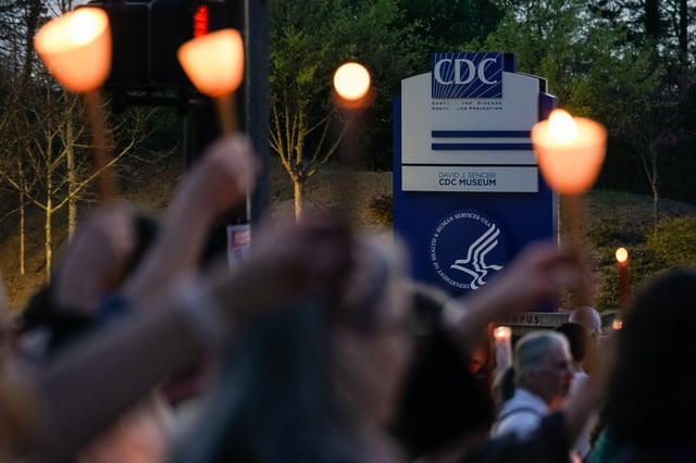 ATLANTA, GEORGIA - MARCH 28: People participate in a candlelight vigil in front of the main offices of the Centers for Disease Control (CDC) on March 28, 2025 in Atlanta, Georgia. On Thursday HHS Secretary Robert F. Kennedy Jr. announced plans to cut 10,000 jobs across the agency and merge core functions into a new organization called the Administration for Healthy America. (Photo by Elijah Nouvelage/Getty Images)