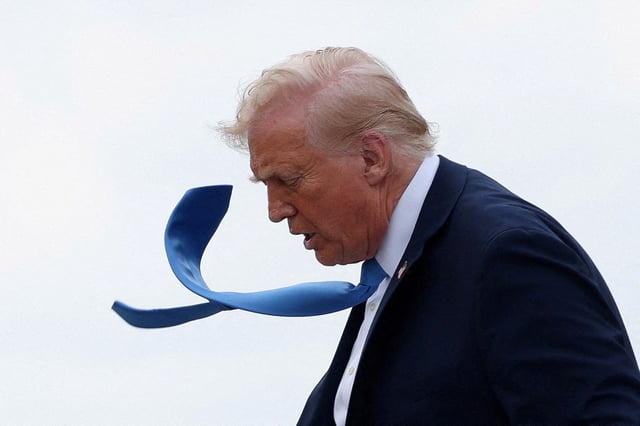 US President Donald Trump disembarks Air Force One in West Palm Beach, Florida, U.S., March 28, 2025. REUTERS/Kevin Lamarque//File Photo