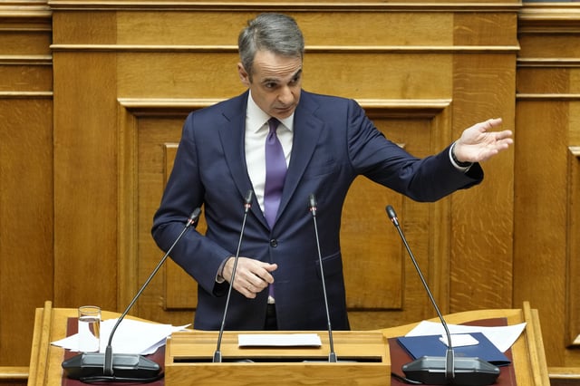 Greece's Prime Minister Kyriakos Mitsotakis speaks during a presentation of military spending plans, at the Greek Parliament, in Athens, Wednesday, April 2, 2025. (AP Photo/Petros Giannakouris)
