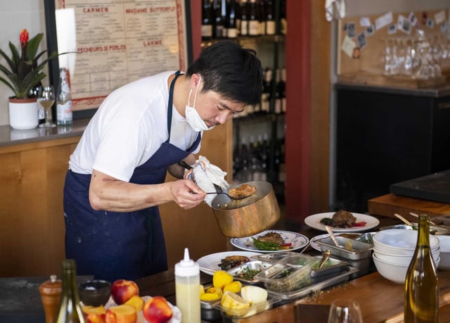 Kosuke Tada, chef-owner of Mijoté, prepares a main course of lamb with piquillo peppers and lemon at Mijoté in San Francisco. The chef is a finalist for a James Beard Award for Best Chef: California.