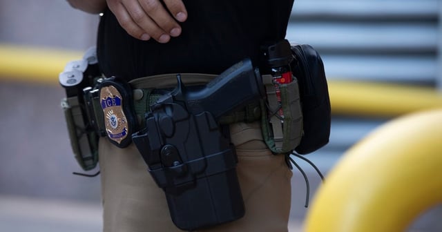 A U.S. Immigration and Customs Enforcement (ICE) agent’s badge in front of the J.J. Pickle Federal Building in downtown Austin, Texas, on Tuesday, April 1, 2025.