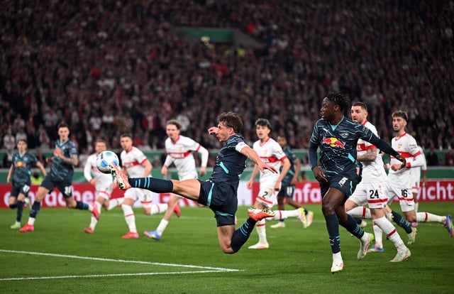 Soccer Football - DFB Cup - Semi Final - VFB Stuttgart v RB Leipzig - MHPArena, Stuttgart, Germany - April 2, 2025 RB Leipzig's Willi Orban and El Chadaille Bitshiabu in action REUTERS/Angelika Warmuth