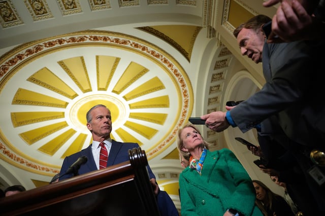 Sen. John Thune speaks alongside Sen. Shelley Moore Capito speaks to reporters following the weekly Republican Senate policy luncheon at the US Capitol on April 1 in Washington, DC.