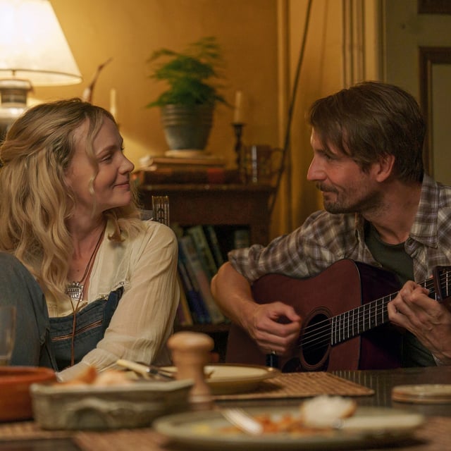 This image released by Focus Features shows Carey Mulligan, left, and Tom Basden in a scene from "The Ballad of Wallis Island." (Focus Features via AP)
