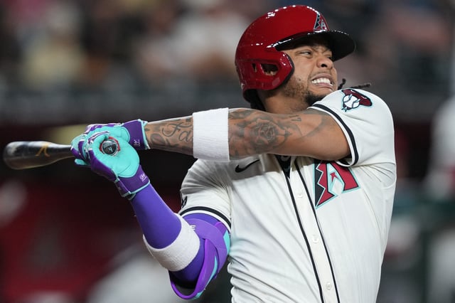 Mar 27, 2025; Phoenix, Arizona, USA; Arizona Diamondbacks second base Ketel Marte (4) winces as he fouls off a pitch against the Chicago Cubs during the eighth inning at Chase Field. Mandatory Credit: Joe Camporeale-Imagn Images/File Photo