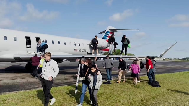 Passengers on an American Airlines regional jet evacuated on the runway, Tuesday, after experiencing, what they describe, as a burning smell and light smoke inside the cabin.