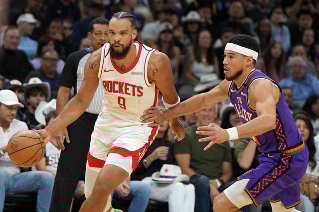 Mar 30, 2025; Phoenix, Arizona, USA; Houston Rockets forward Dillon Brooks (9) drives past Phoenix Suns guard Devin Booker (1) in the first half at Footprint Center. Mandatory Credit: Rick Scuteri-Imagn Images/File Photo