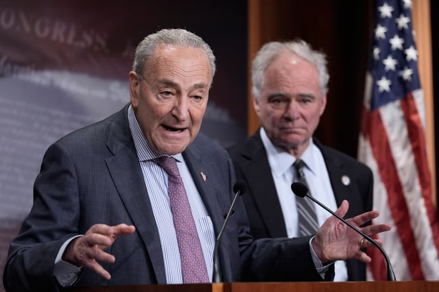 Senate Minority Leader Chuck Schumer, D-N.Y., is joined by Sen. Tim Kaine, D-Va., right, as they speak to reporters about President Donald Trump's so-called "Liberation Day" of tariffs on foreign countries, at the Capitol, in Washington, Wednesday, April 2, 2025. (AP Photo/J. Scott Applewhite)