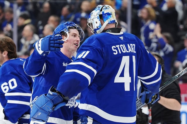 Toronto Maple Leafs' Mitch Marner (16) and goaltender Anthony Stolarz (41) celebrate after defeating the Florida Panthers in NHL hockey action in Toronto on Wednesday, April 2, 2025. THE CANADIAN PRESS/Frank Gunn