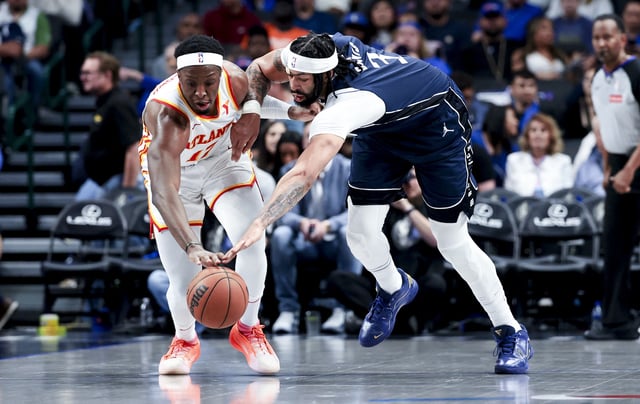 Apr 2, 2025; Dallas, Texas, USA; Atlanta Hawks forward Onyeka Okongwu (17) and Dallas Mavericks forward Anthony Davis (3) go for a loose ball during the second half at American Airlines Center. Mandatory Credit: Kevin Jairaj-Imagn Images