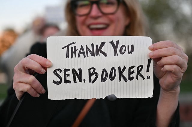 Supporters of Sen. Cory Booker, D-N.J., gather outside the U.S. Capitol as he speaks on the Senate floor on April 1, 2025.