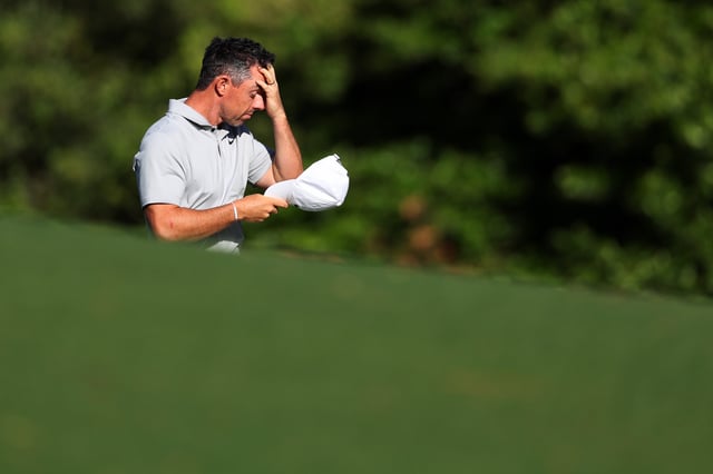 Rory McIlroy of Northern Ireland reacts after a double bogey on the 11th hole during the second round of the 2024 Masters Tournament at Augusta National Golf Club on April 12, 2024 in Augusta, Georgia.