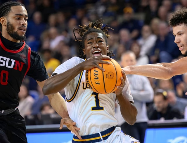 UC Irvine guard Torian Lee, center, drives past Cal State Northridge guard Tyler Beard, left, and forward Grady Lewis, right, during a Big West Conference game earlier this season at UCI’s Bren Events Center. (Photo by Paul Rodriguez, Contributing Photographer)