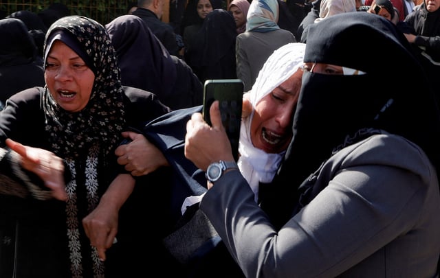 Palestinians mourn medics, who came under Israeli fire while on a rescue mission, after their bodies were recovered, according to the Red Crescent, at Nasser hospital in Khan Younis in the southern Gaza Strip March 31, 2025. REUTERS/Hatem Khaled/File Photo