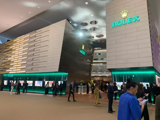 Visitors are seen near the Rolex booth during the Watches and Wonders fair, a day after U.S. President Donald Trump imposed a 31% tariff on imports from Switzerland, in Geneva, Switzerland, April 3, 2025.  REUTERS/Cecile Mantovani