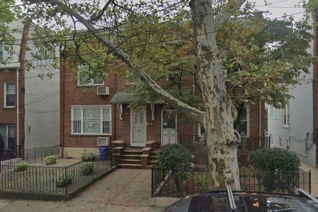 The Queens home where police say an unlicensed man performed a botched surgical procedure that left a woman in critical condition.