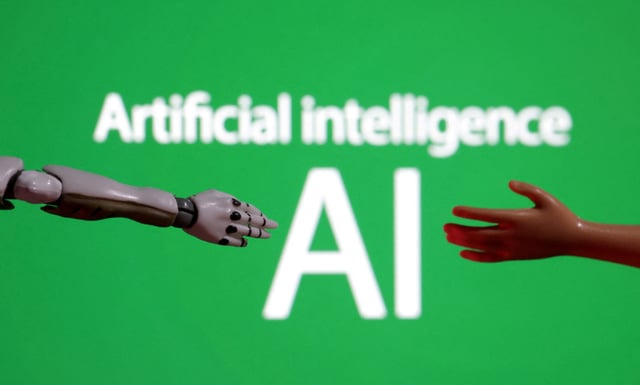 Words reading "Artificial intelligence AI", miniature of robot and toy hand are pictured in this illustration taken December 14, 2023. REUTERS/Dado Ruvic/Illustration/File Photo