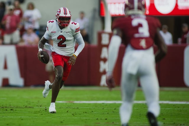 Aug 31, 2024; Tuscaloosa, Alabama, USA; Western Kentucky Hilltoppers quarterback TJ Finley (2) runs the ball against the Alabama Crimson Tide during the first quarter at Bryant-Denny Stadium. Mandatory Credit: Will McLelland-USA TODAY Sports/File Photo