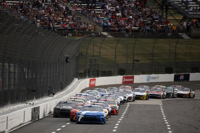 Denny Hamlin, driver of the #11 Progressive Toyota, leads the field during the NASCAR Cup Series Cook Out 400 at Martinsville Speedway on March 30, 2025 in Martinsville, Virginia.