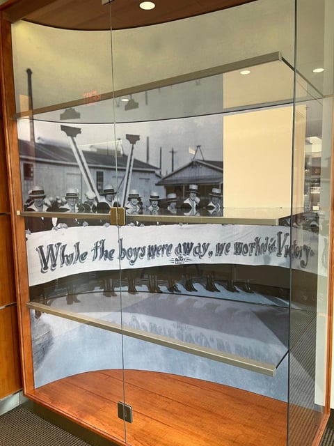 The large white piece of cardboard on the left side of the display case was put up to block a sign that talked about “Jewish women in the Navy,” according to the Military Religious Freedom Foundation.