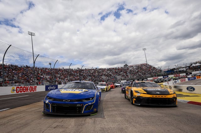 Chase Elliott, driver of the #9 NAPA Auto Parts Chevrolet, and Christopher Bell, driver of the #20 DEWALT Outdoors Toyota, lead the field on a pace lap prior to the NASCAR Cup Series Cook Out 400 at Martinsville Speedway on March 30, 2025 in Martinsville, Virginia.