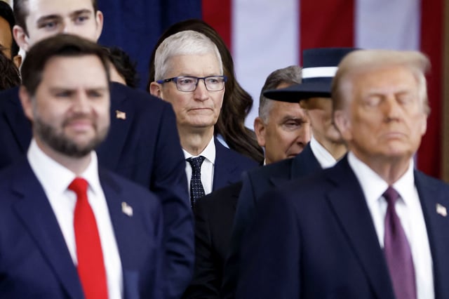 Apple CEO Tim Cook looks on behind President Donald Trump and Vice President JD Vance after the two were sworn into office at an inauguration ceremony in the rotunda of the U.S. Capitol in Washington on Jan. 20, 2025.