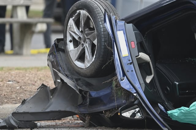 The scene where a mother and two children died after being struck by an Audi operated by a 32-year-old woman with a suspended license on March 29.