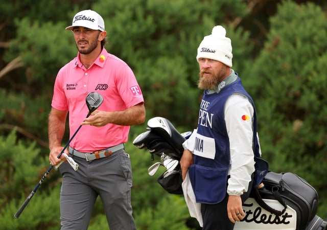 TROON, SCOTLAND - JULY 18: Max Homa of the United States and his caddie Joe Greiner look on from the 12th tee on day one of The 152nd Open championship at Royal Troon on July 18, 2024 in Troon, Scotland.