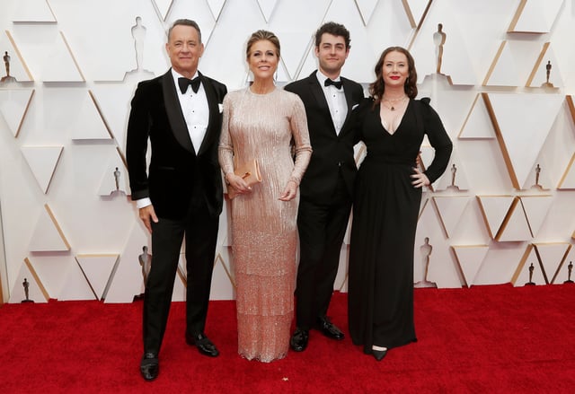 Tom Hanks, Rita Wilson, Truman Theodore Hanks and Elizabeth Hanks pose on the red carpet during the Oscars arrivals at the 92nd Academy Awards in February 2020.