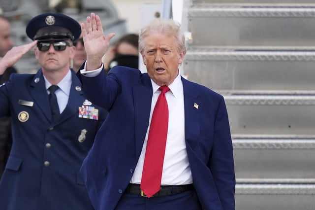 President Donald Trump waves as he arrives on Air Force One at Miami International Airport, Thursday, April 3, 2025, in Miami. (AP Photo/Rebecca Blackwell)