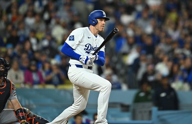 Mar 29, 2025; Los Angeles, California, USA; Los Angeles Dodgers first baseman Freddie Freeman (5) hits a double in the seventh inning against the Detroit Tigers at Dodger Stadium. Mandatory Credit: Jonathan Hui-Imagn Images/File Photo